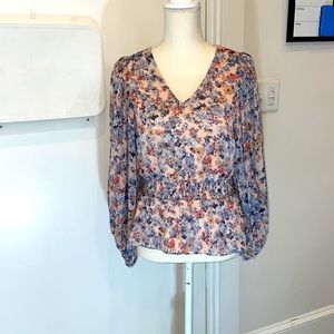 Floral blouse with bubble like sleeves. Very cute dressed up or down
